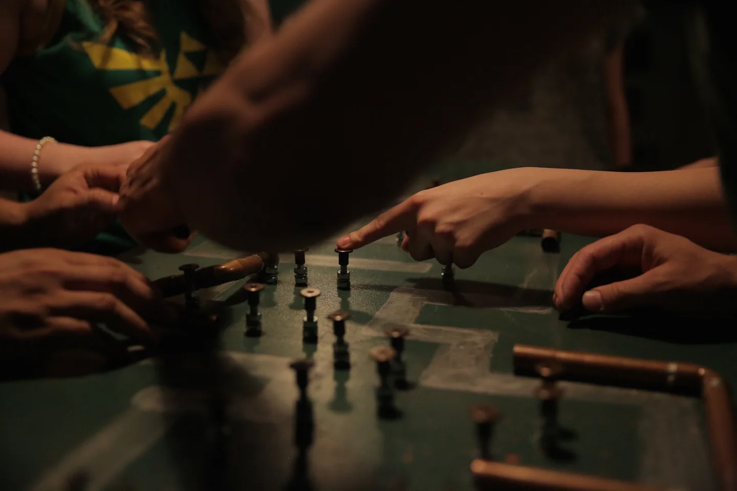 Participants solving a tabletop puzzle at Escape the Castle